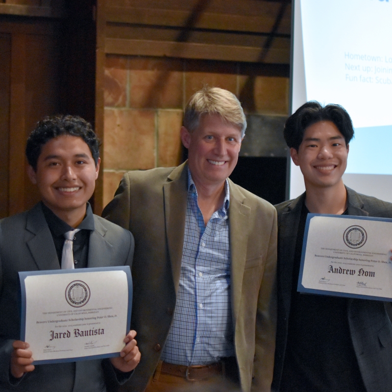 Chair Stacey presents the Beavers Heavy Construction Scholarship to Jared Bautista and Andrew Hom (left to right). (Photo Credit: Erin Leigh Inama).