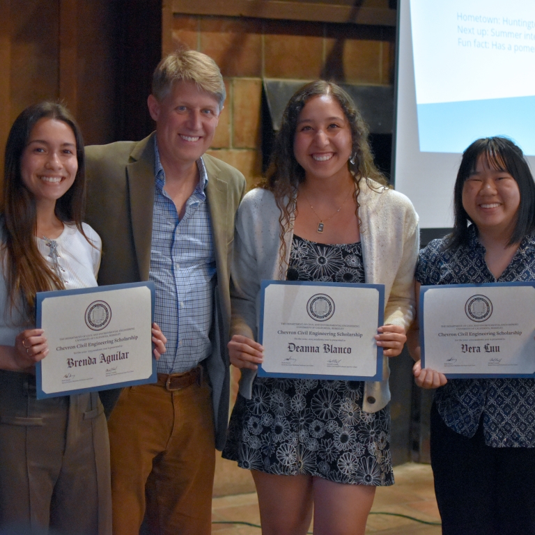 Chair Stacey presents the Chevron Environmental Engineering Scholarship to Brenda Aguilar, Deanna Blanco, and Vera Luu (left to right). (Photo Credit: Erin Leigh Inama).