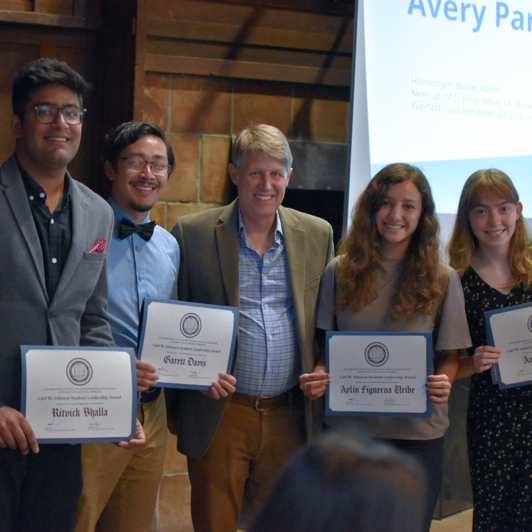 Chair Stacey presents the Carl W. Johnson Student Leadership Award to Ritvick Bhalla, Garett Davis, Aylin Figueroa Uribe, and Avery Park (left to right). (Photo Credit: Erin Leigh Inama).