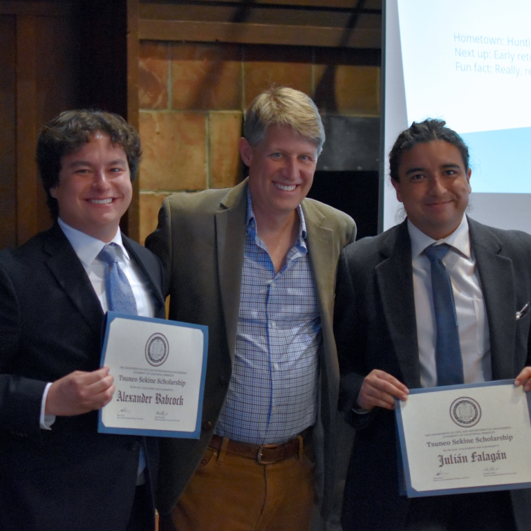 Chair Stacey presents the Tsuneo Sekine Fellowship to Alexander Babcock and Julián Falagán (left to right). (Photo Credit: Erin Leigh Inama).