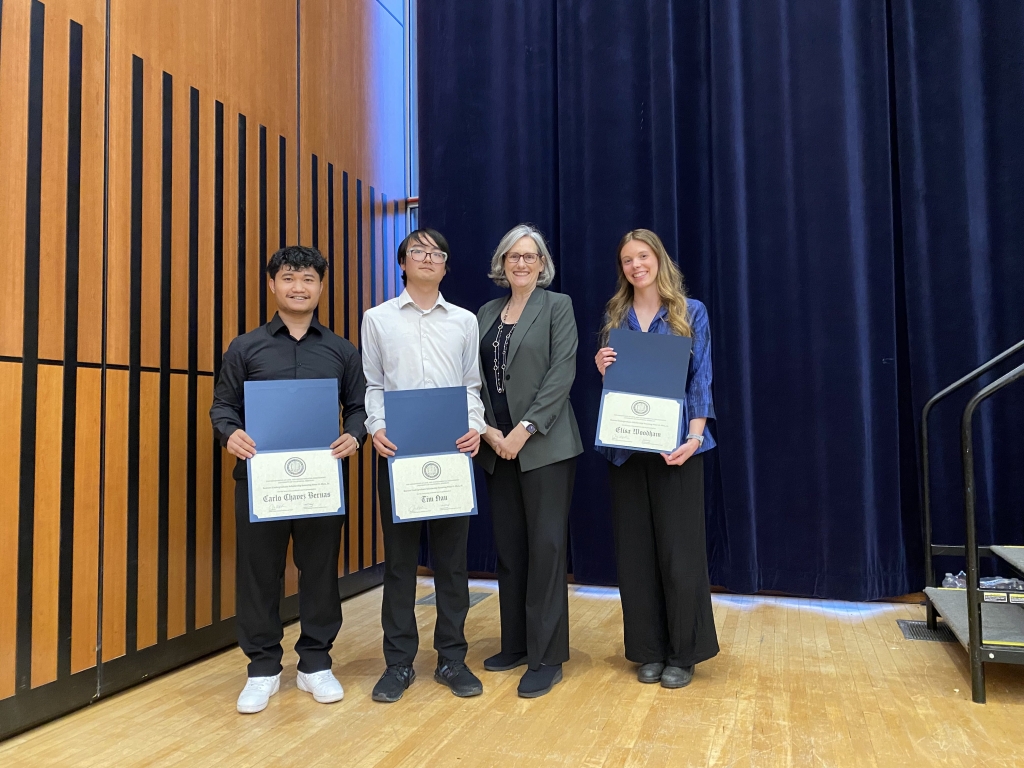 Chair Joan Walker presents the Beavers Heavy Construction Scholarship to Carlo Chavez Bernas, Tim Han, and Elisa Woodham. (Pictured left to right: Carlo Chavez Bernas, Tim Han, Chair Joan Walker, and Elisa Woodham. Photo Credit: Sarah Solis)