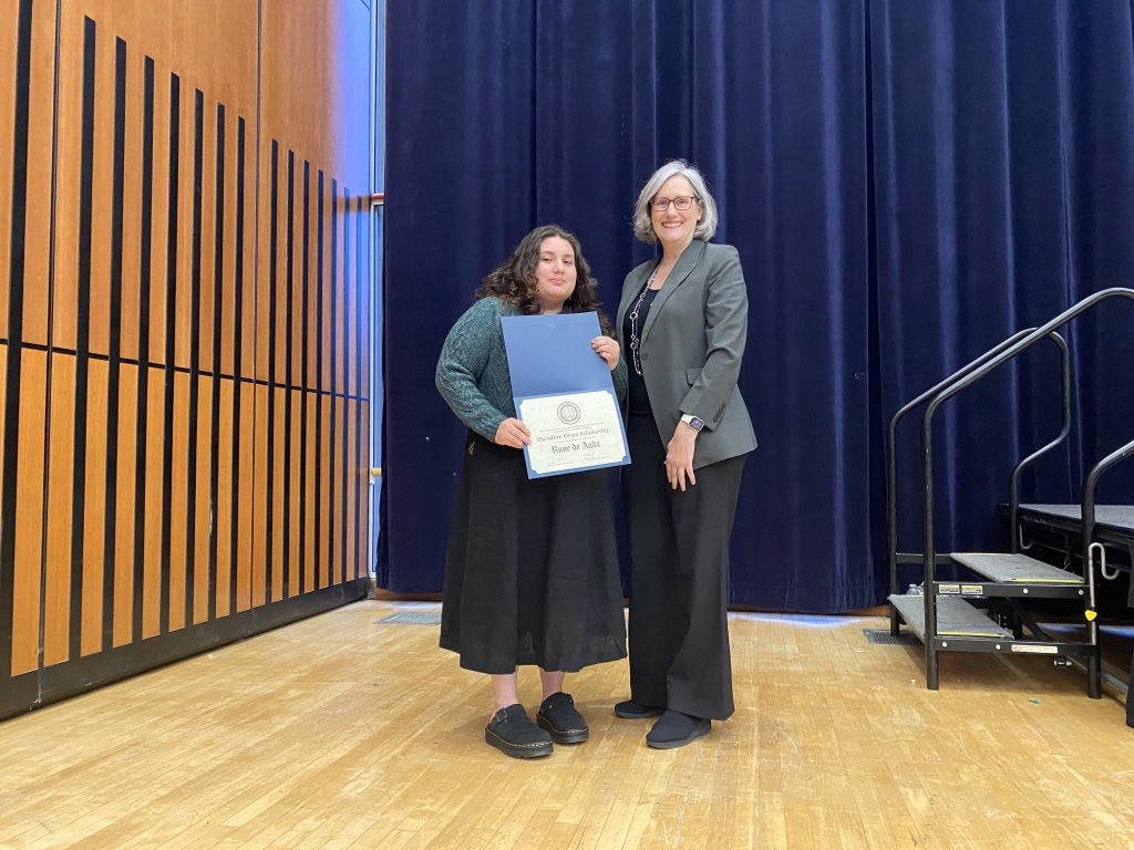 Chair Joan Walker presents Rune de Anda with the Theodore Olsen Scholarship. (Pictured left to right: Rune de Anda (left) and Chair Joan Walker (right). Photo Credit: Sarah Shaadi Sadeh)
