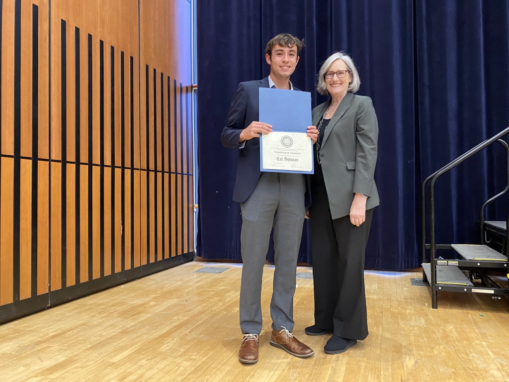 Chair Joan Walker presents Cal Holman with the Departmental Citation. (Pictured left to right: Cal Holman and Chair Joan Walker. Photo Credit: Sarah Shaadi Sadeh)
