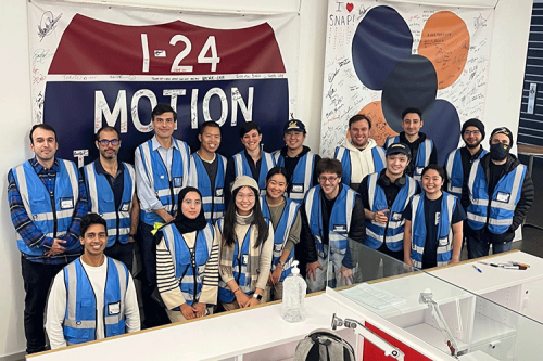 CIRCLES team members pose in front of signed I-24 MOTION and CIRCLES banners.