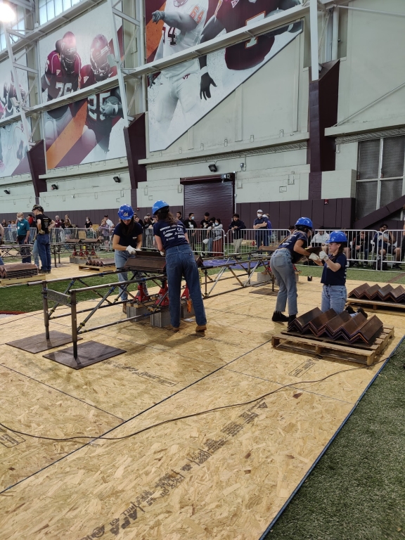 Four Steel Bridge members loading their bridge at Nationals.