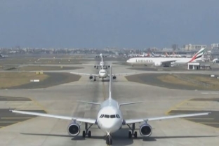 A long queue of smaller aircraft interspersed with a larger aircraft. (Source: https://aviationsystems.arc.nasa.gov/research/atd2/index.shtml)