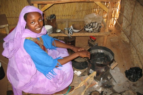 Woman using Darfur Stove