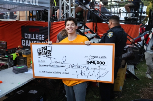 CEE Sophomore Daniel Villasenor holds a check for $100,000 after winning ESPN's field goal contest. (Photo Credit: UC Berkeley News)