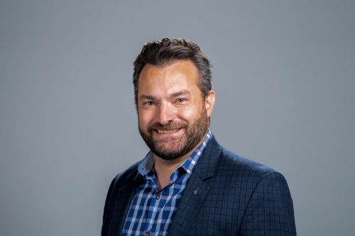 A headshot of CEE Professor Dimitrios Konstantinidis against a charcoal grey background (Photo Credit: Adam Lau/Berkeley Engineering).