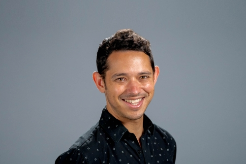 A headshot of CEE Professor Scott Moura with a charcoal grey background (Photo Credit: Berkeley Engineering/Adam Lau).