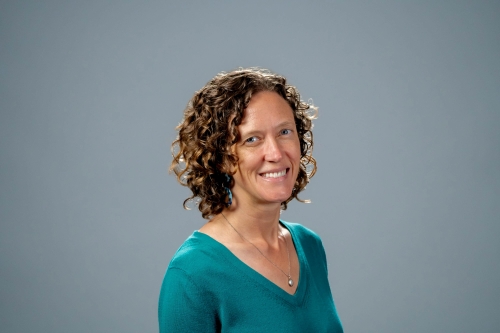 A headshot of CEE Professor Amy Pickering against a charcoal grey background (Photo Credit: Adam Lau/Berkeley Engineering).