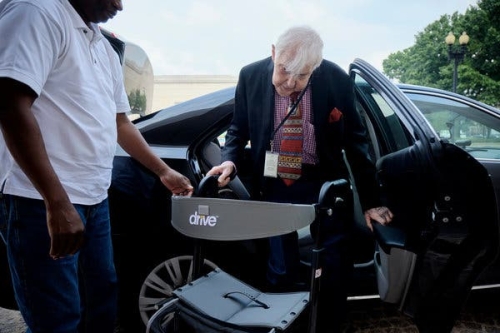 Older man using ride-sharing service