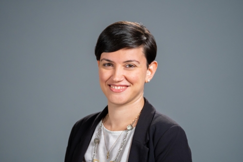 A headshot of CEE Assistant Professor Maria Laura Delle Monache, with a charcoal grey background. (Photo Credit: Adam Lau/Berkeley Engineering)