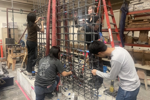 William Wang, a Ph.D. student, along with undergraduate students Emily Wu, Elisa Woodham, and Annie Xu, prepared the rebar for a scale bridge pier wall test with bidirectional loading in Davis Hall's Structure Lab.