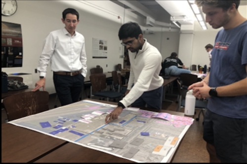 Brian Gaul directs students on the different pieces used to design the private jets expansion at Las Vegas (LAS) Harry Reid International Airport (Photo Credit: Jasenka Rakas).